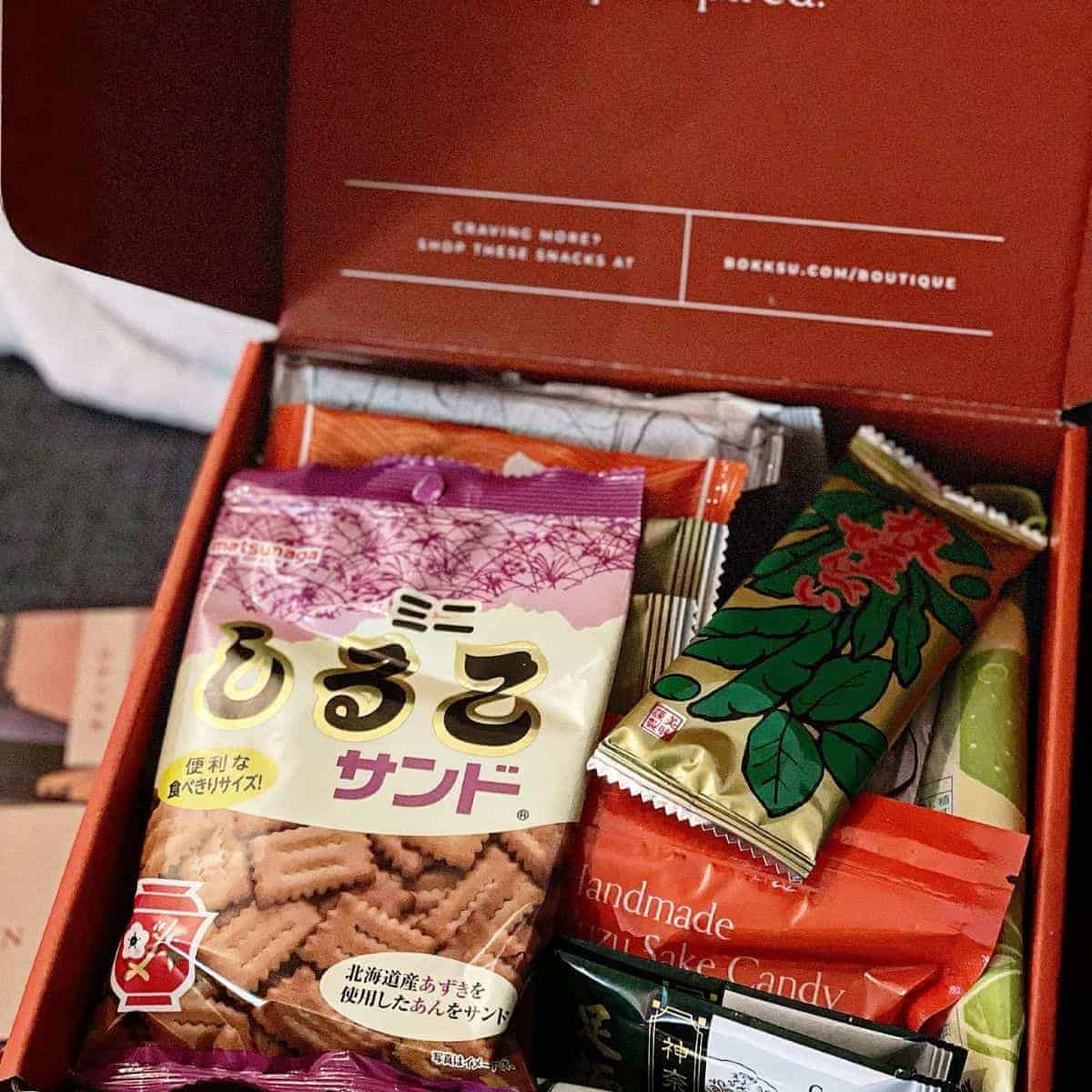 Traditional Asian snacks beautifully arranged in a red container