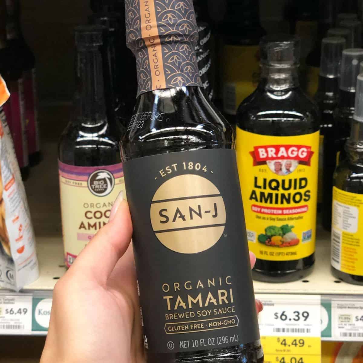 A bottle of Tamari soy sauce as an ingredient for Teriyaki Marinade