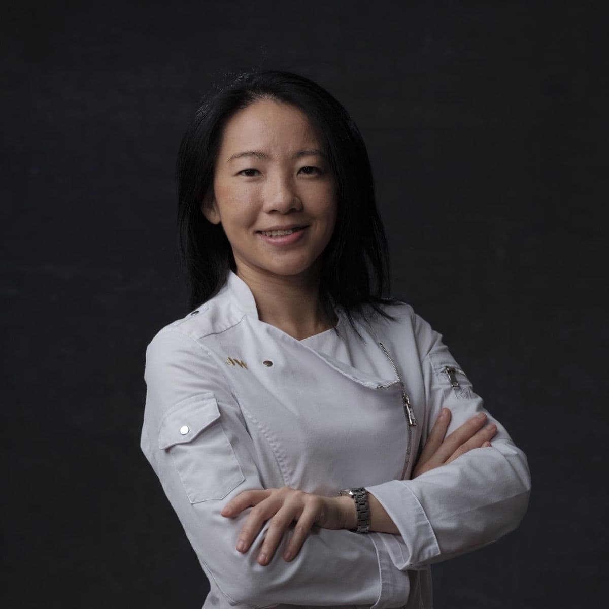 Janice Wong posing in White Chef Jacket