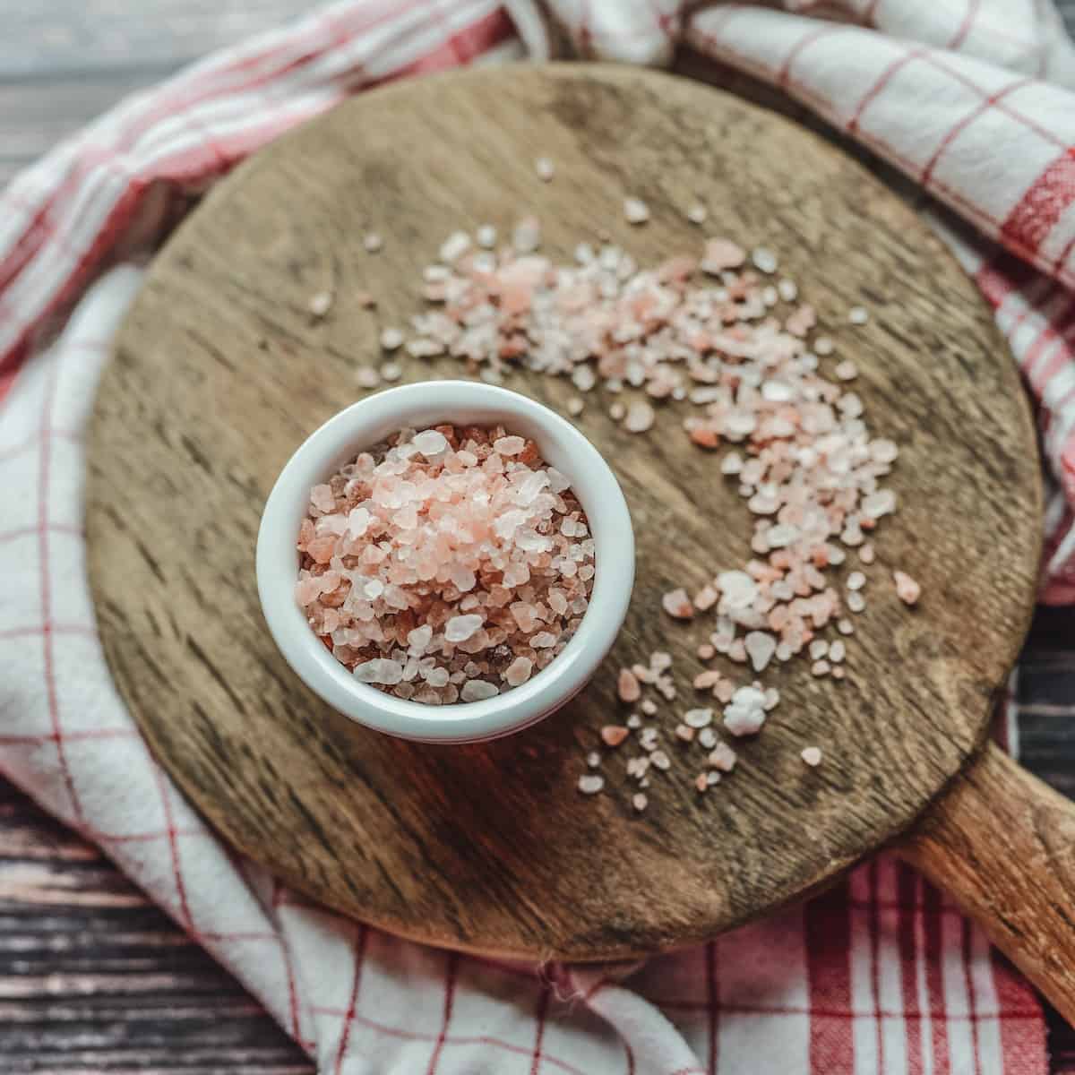 Pink rock salt in a small white bowl