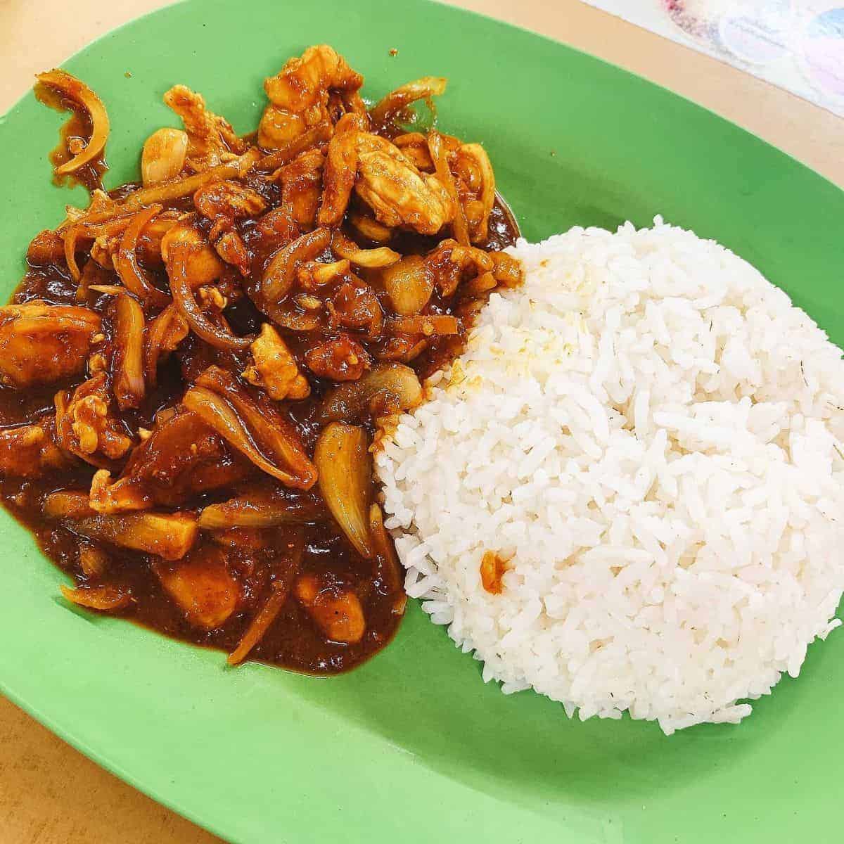 Local Malaysian dish paired with a cup of rice.