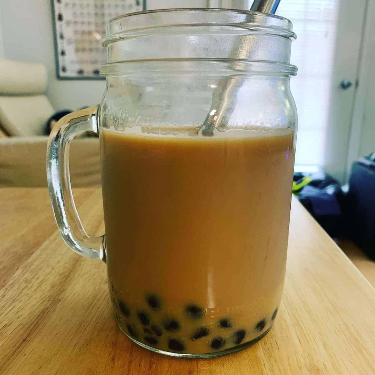 Brownish beverage with black pearls