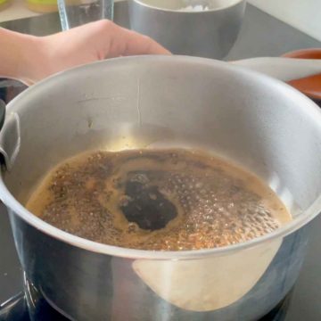 Mix boiling hot water and brown sugar